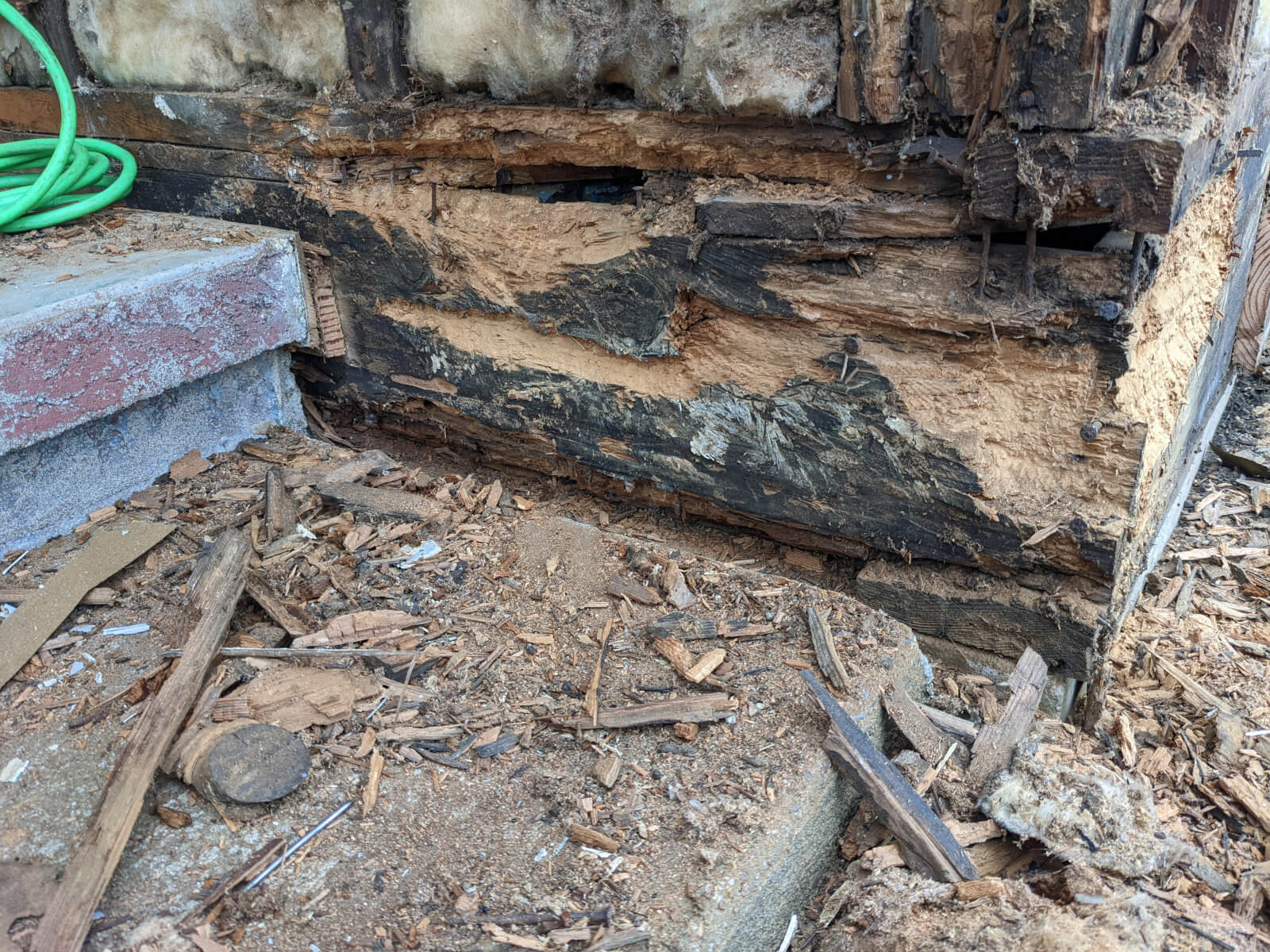 rotted floor and wall framing